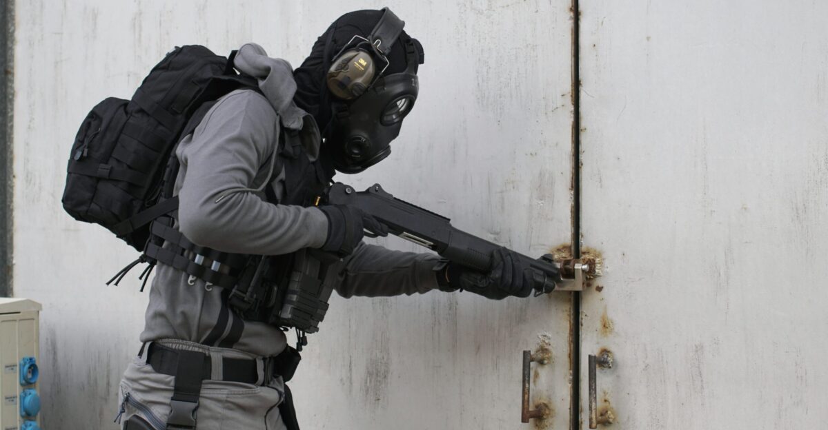 person wearing armor suit carrying shotgun