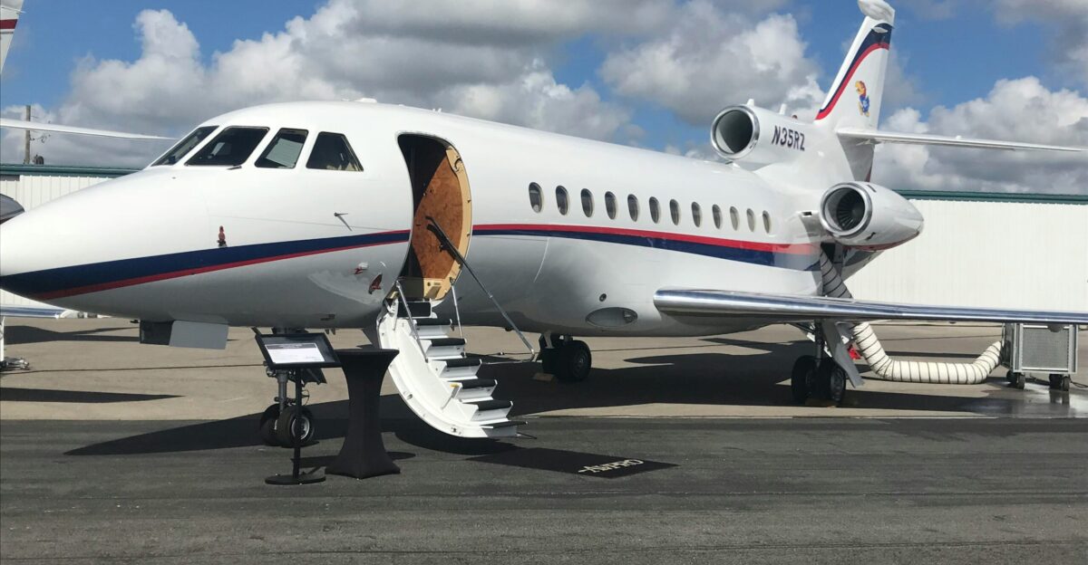 white airliner on gray pavement