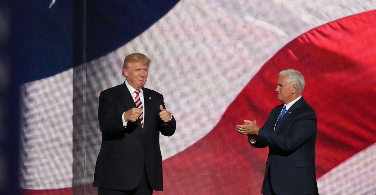 Donald Trump beside man in black suit