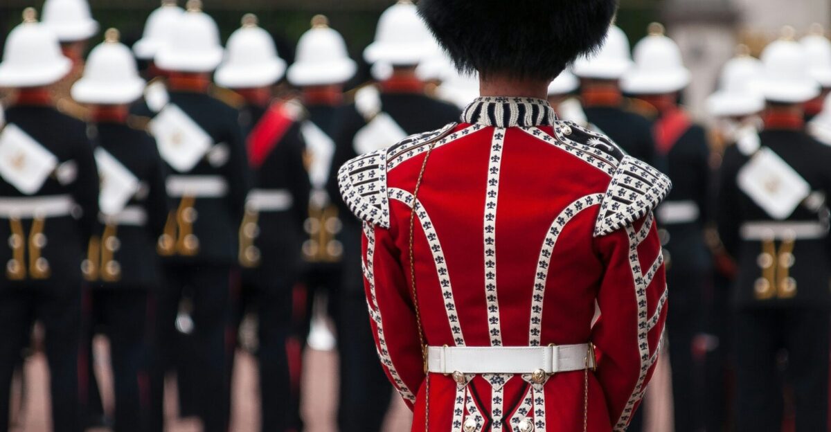 person wearing red and white suit standing near crowd