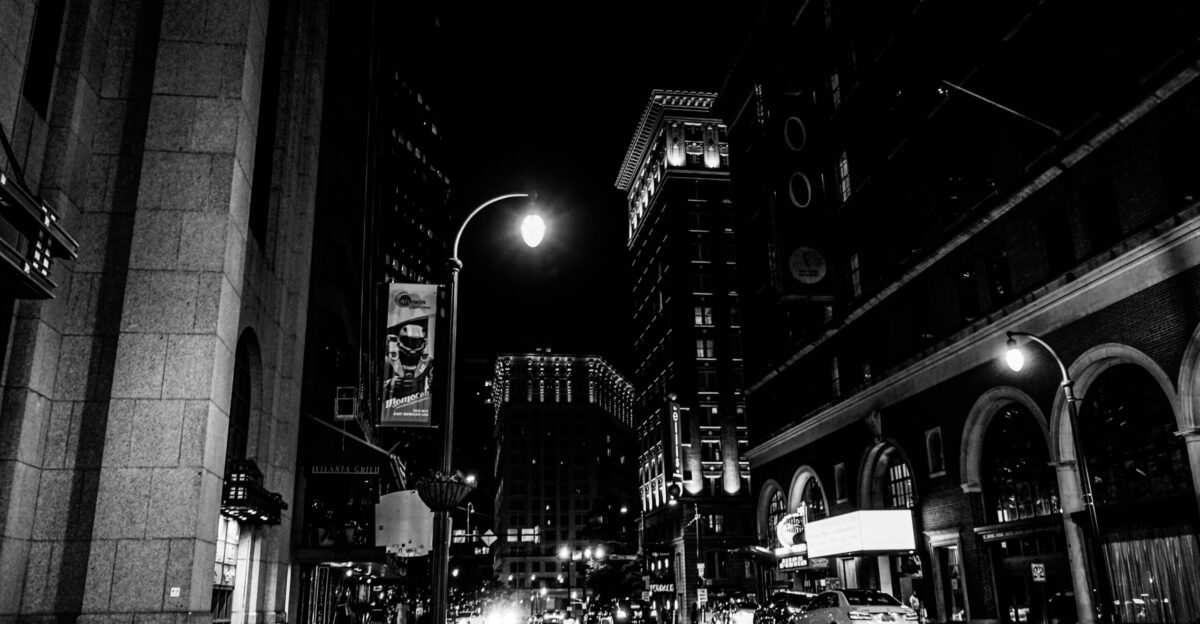 grayscale of vehicles on street