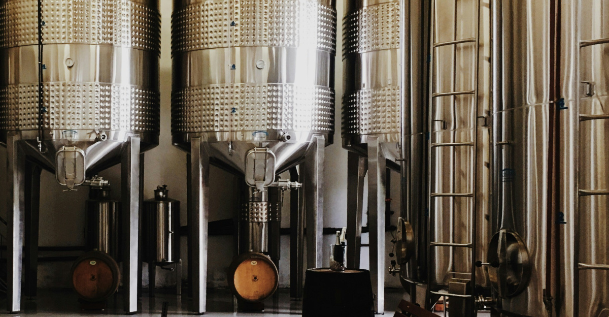 brown cardboard box near gray tanks