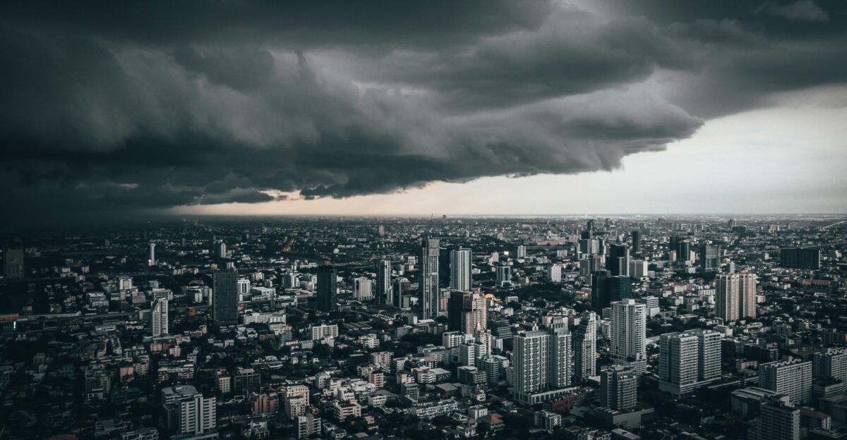 dark cloud above city buildings