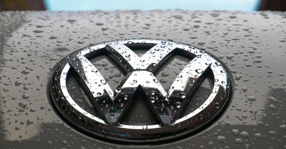 water dew on silver Volkswagen car emblem