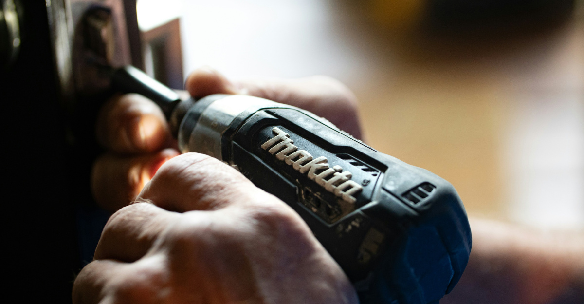 selective focus photography blue and black Makita power drill