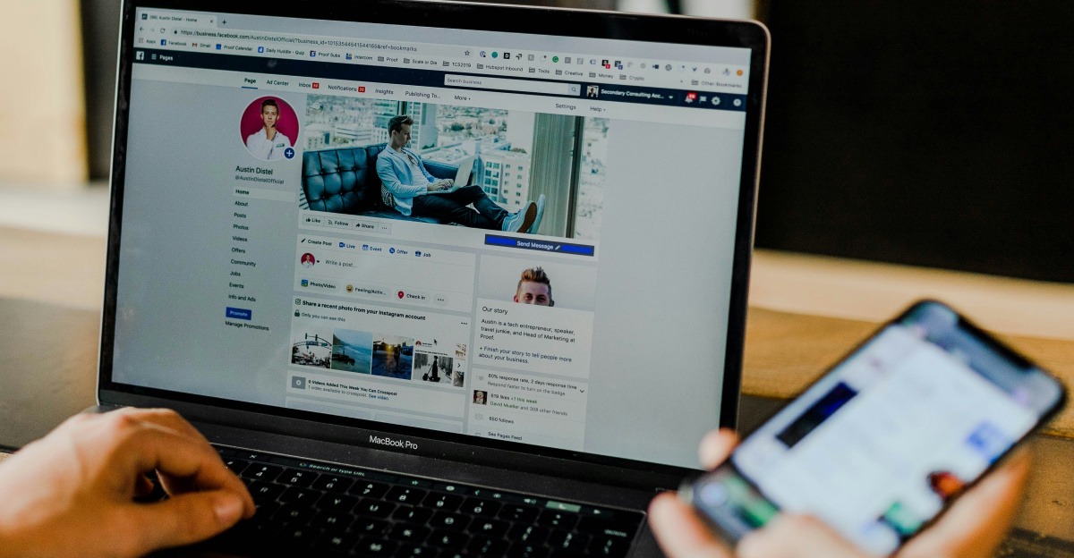 person using both laptop and smartphone