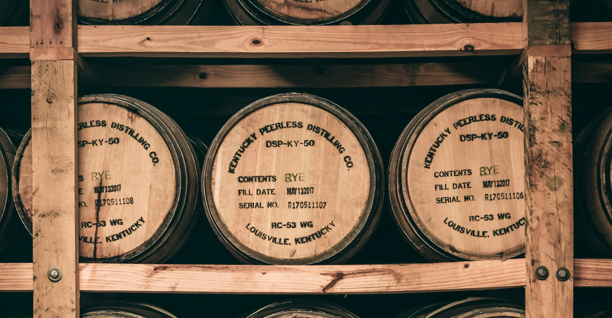 a shelf filled with lots of wooden barrels