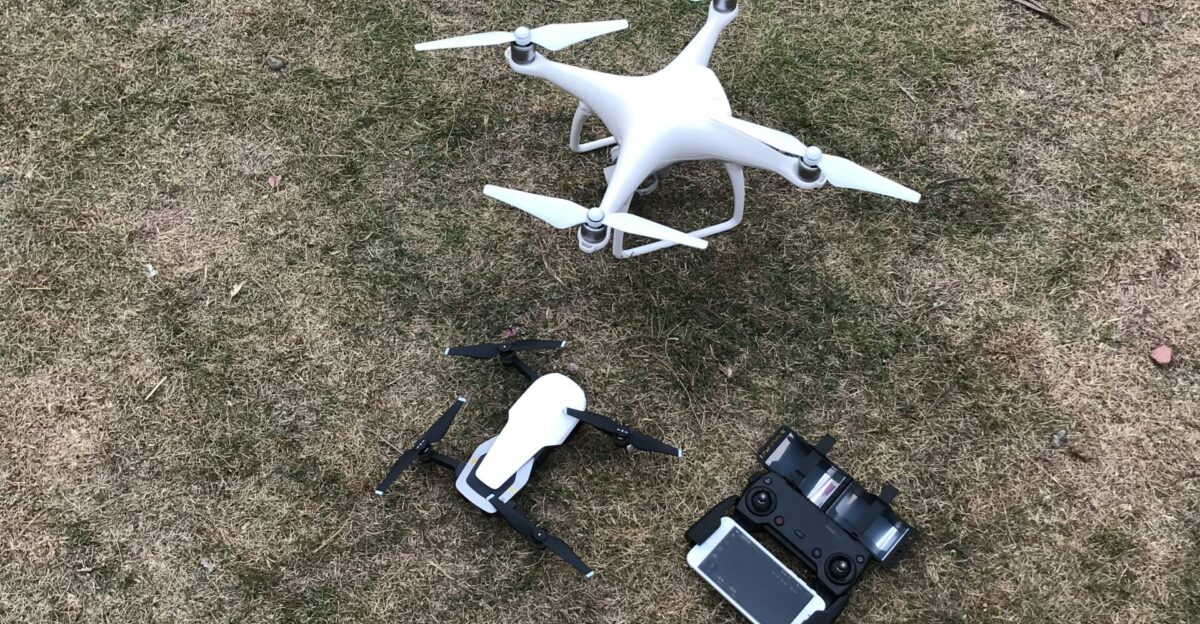white DJI Mavic Pro drone set on grass