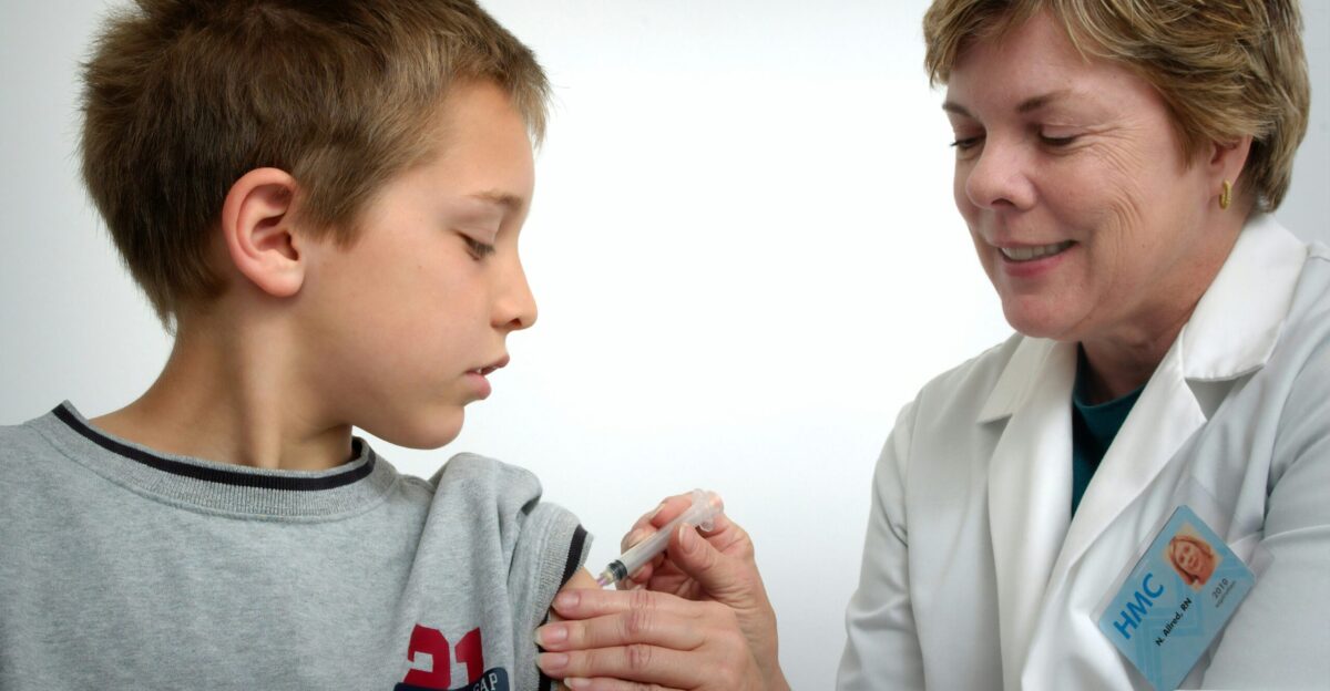 woman inject boy on arm
