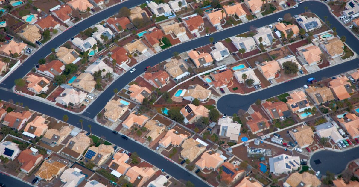 an aerial view of a city with lots of houses