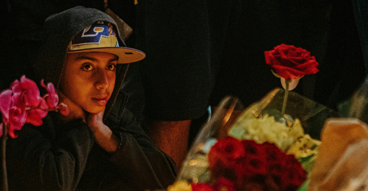 man in black long sleeve shirt sitting beside woman in black long sleeve shirt