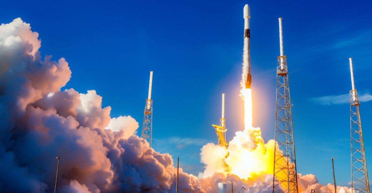 white and red space ship on blue sky during daytime