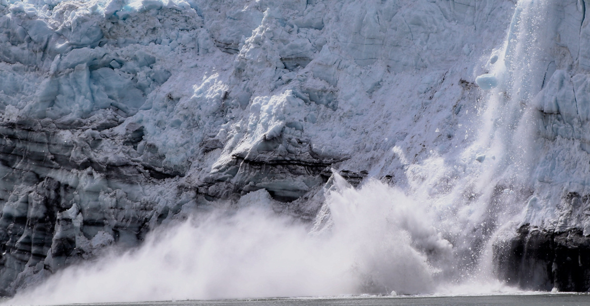 brown rock formation near body of water during daytime