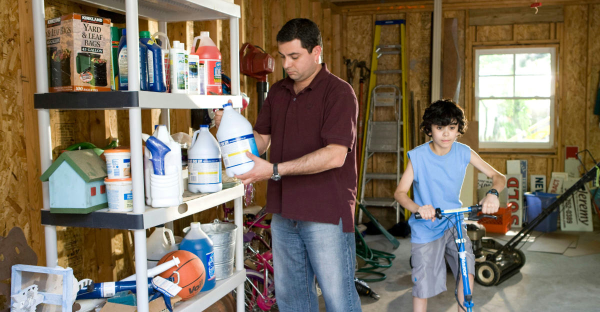 man in brown polo shirt and blue denim jeans standing beside man in blue denim jeans