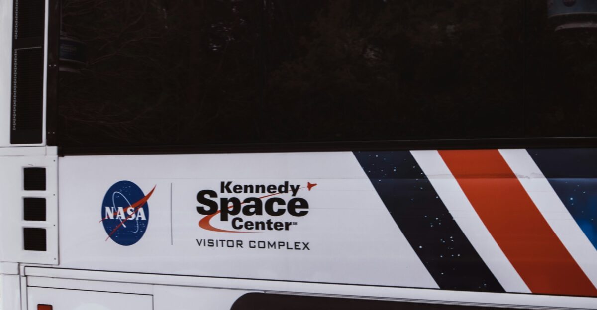 white and orange car showing license plate