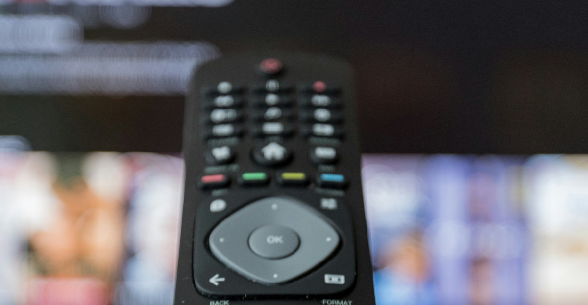 black remote control on brown wooden table