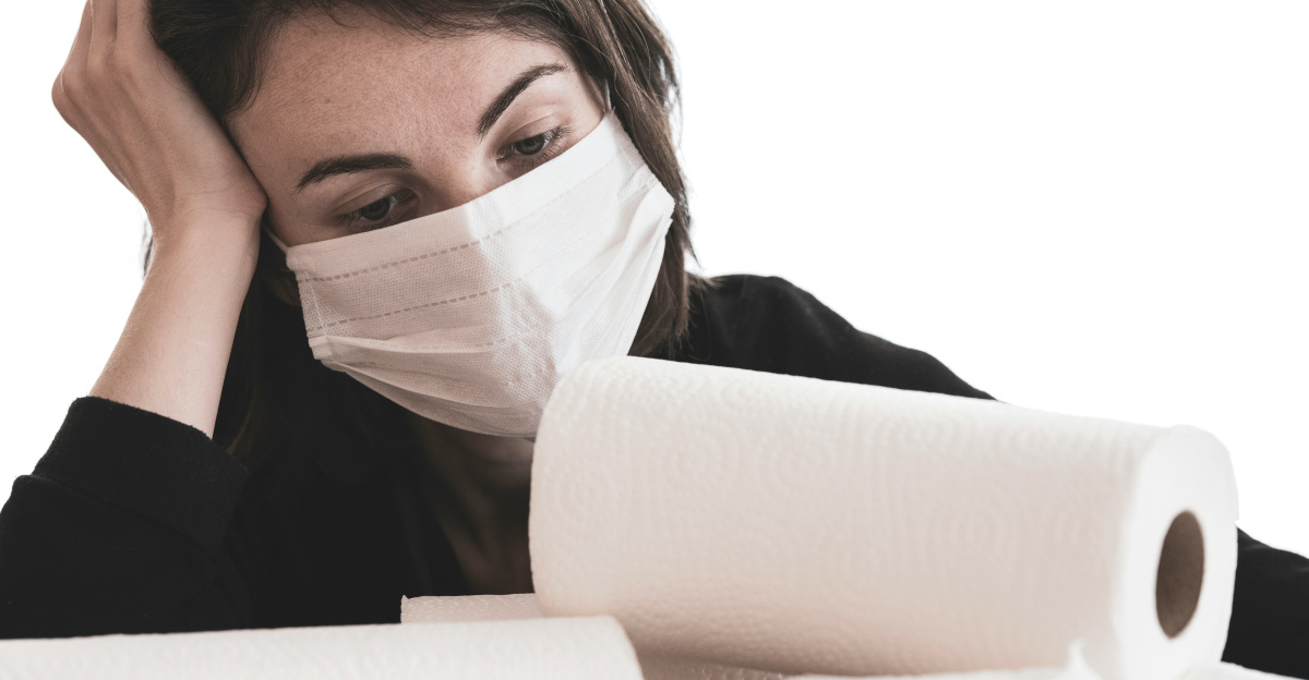 woman covering her face with white tissue paper