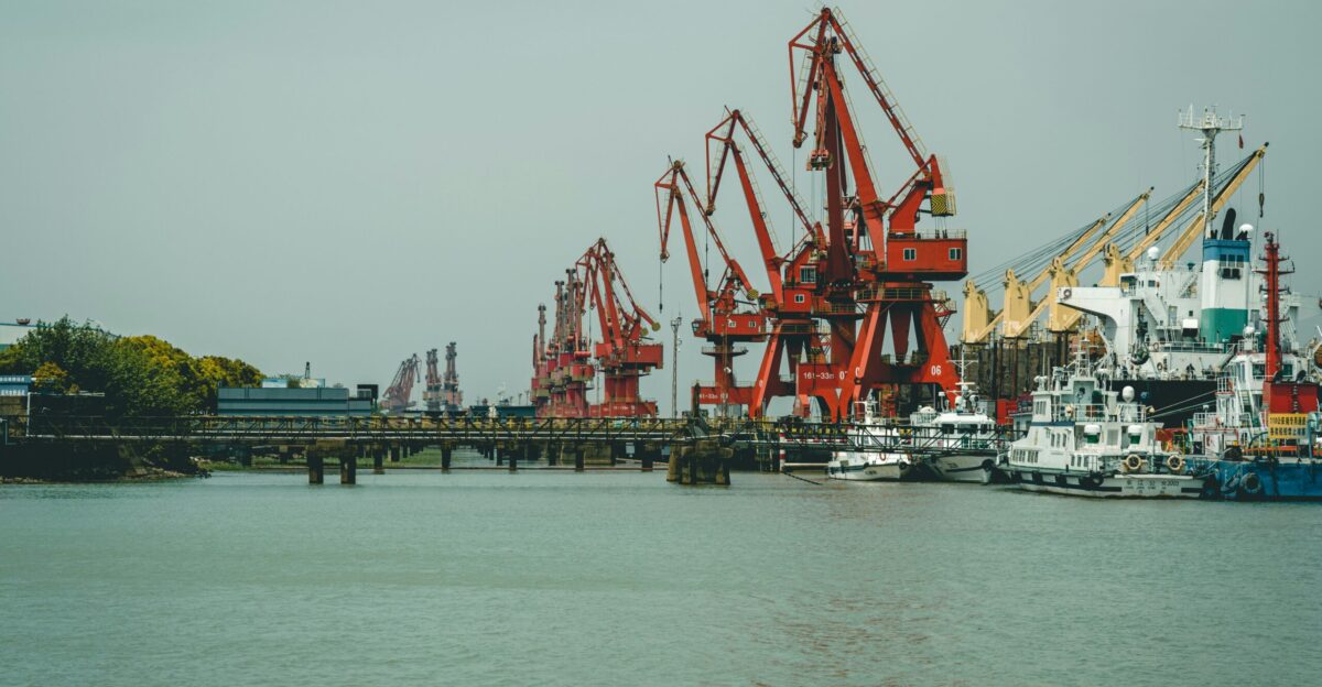 red and white crane on dock during daytime