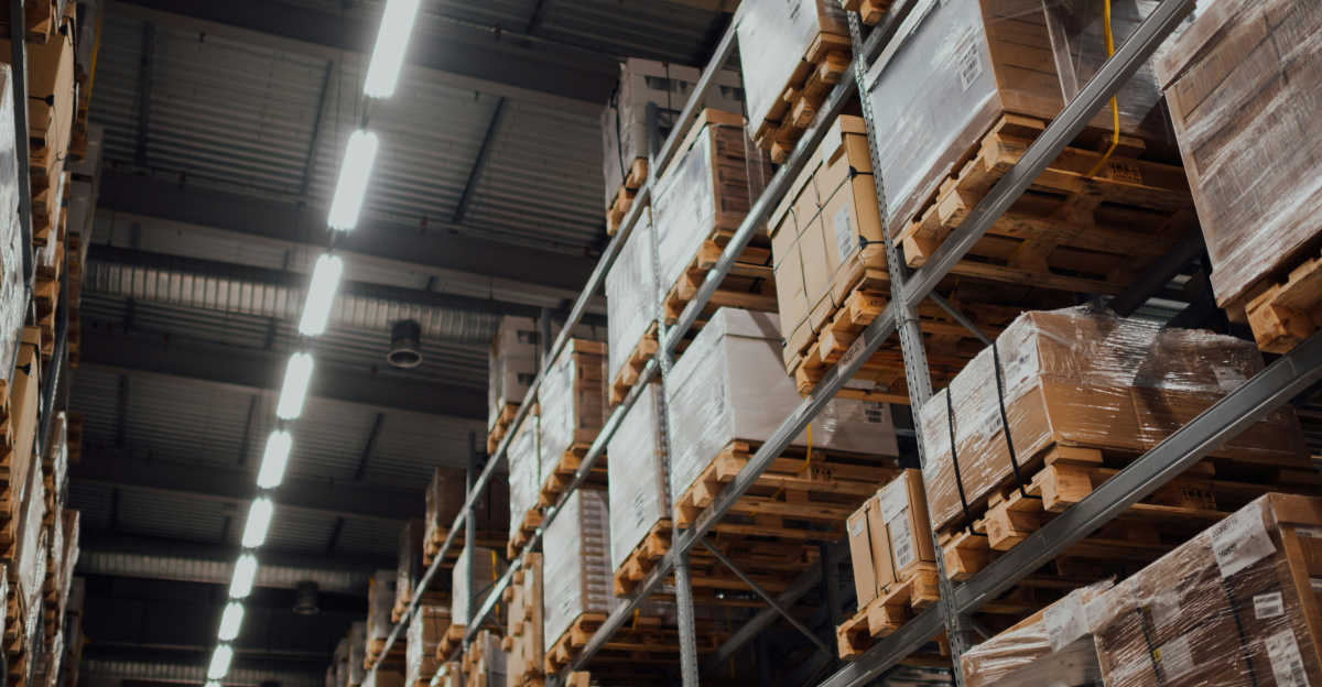 brown cardboard boxes on white metal rack
