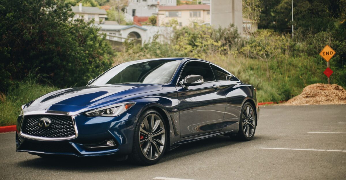 blue bmw m 3 coupe parked on gray concrete road during daytime
