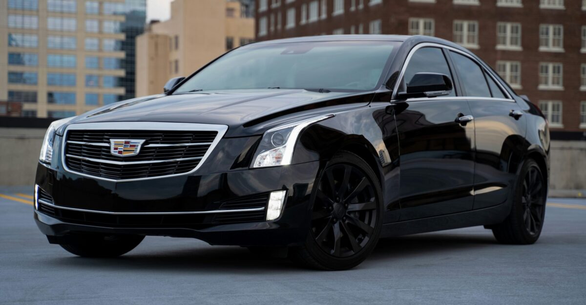black mercedes benz c class parked on road during daytime