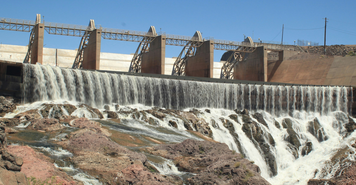 white water dam under blue sky during daytime