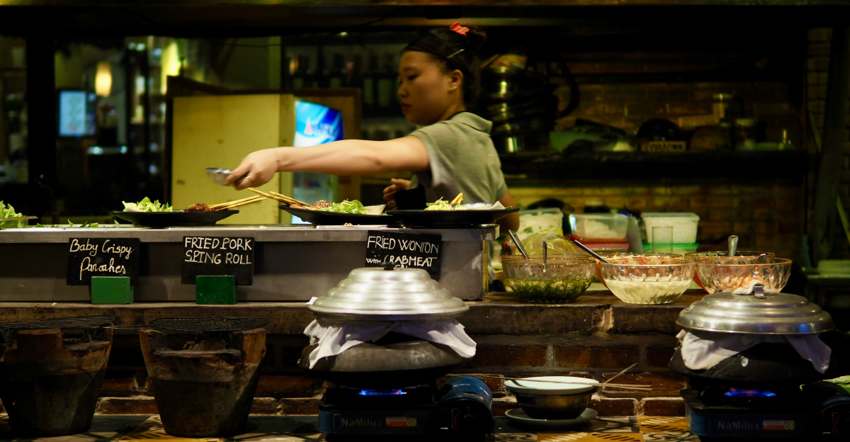 man in white t-shirt cooking