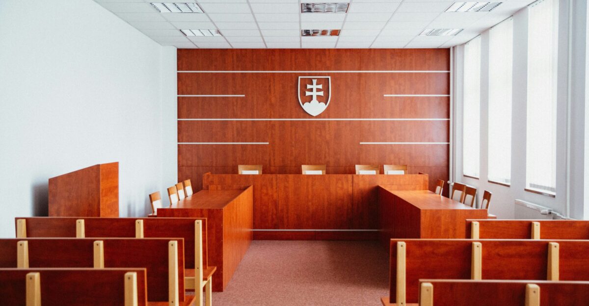 a room filled with wooden desks and chairs