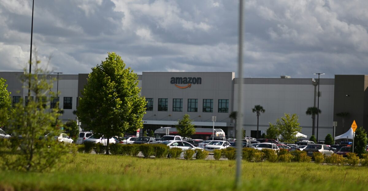 cars parked on parking lot near building during daytime