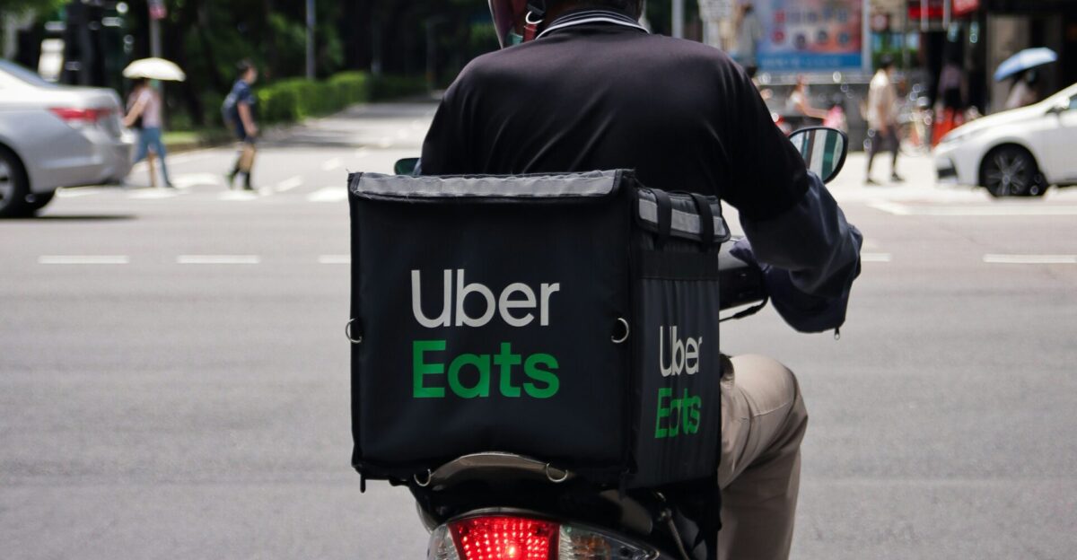 man in black jacket riding motorcycle on road during daytime