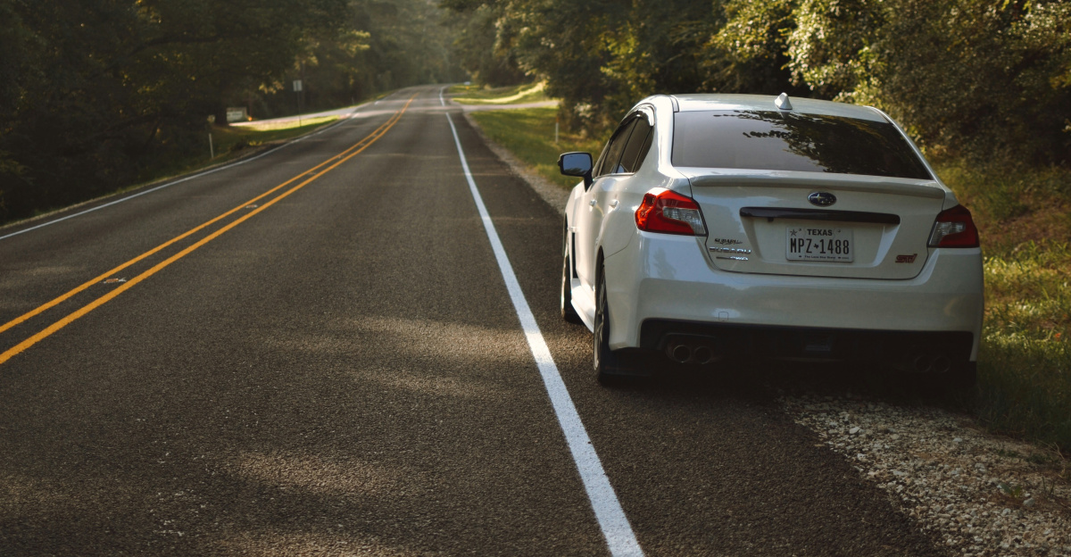 white car on road during daytime