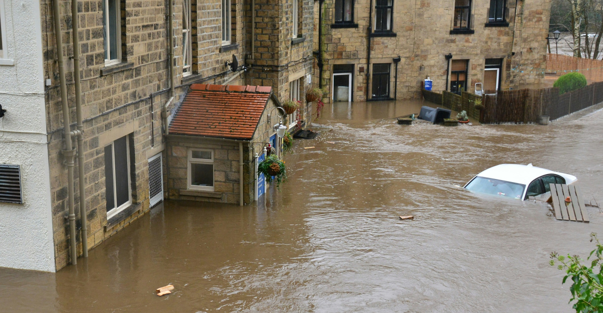 brown and white concrete house beside river during daytime