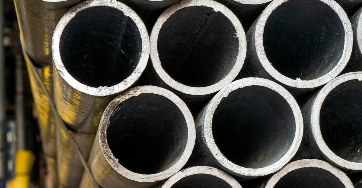 gray plastic cups on wooden table