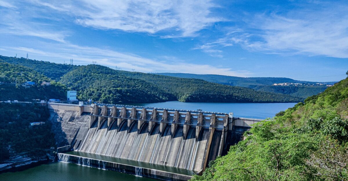 gray concrete dam under blue sky during daytime