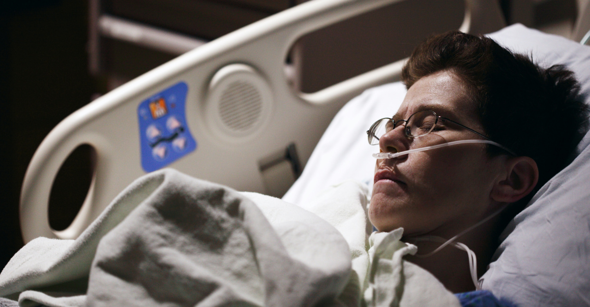 man in blue hoodie wearing eyeglasses