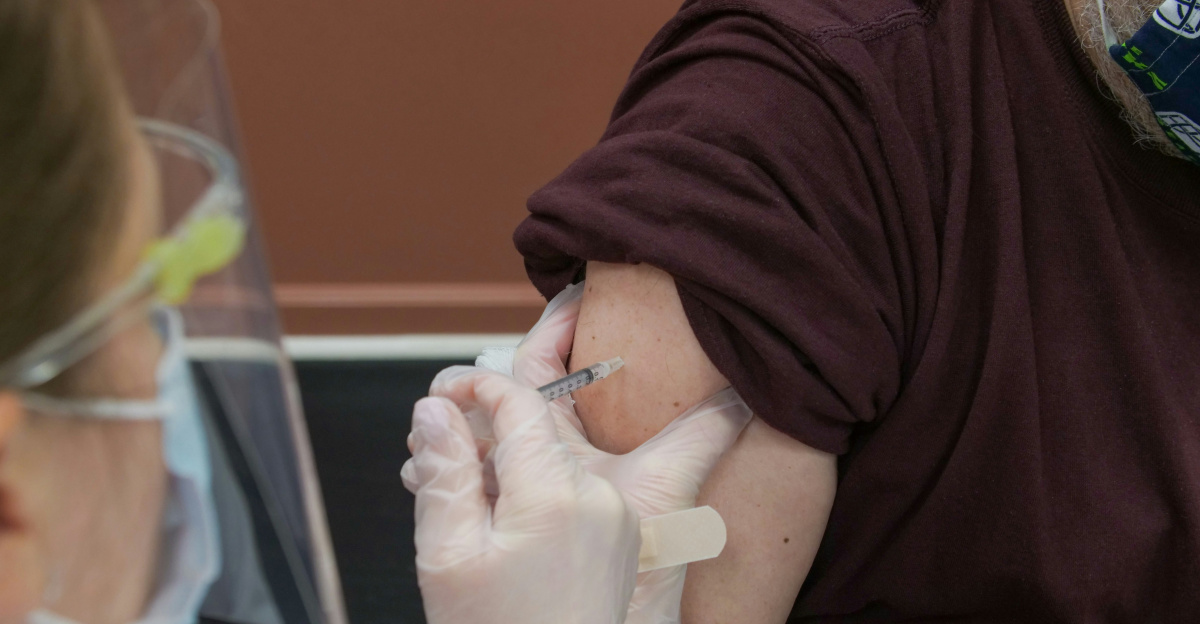 person in brown long sleeve shirt with white bandage on right hand