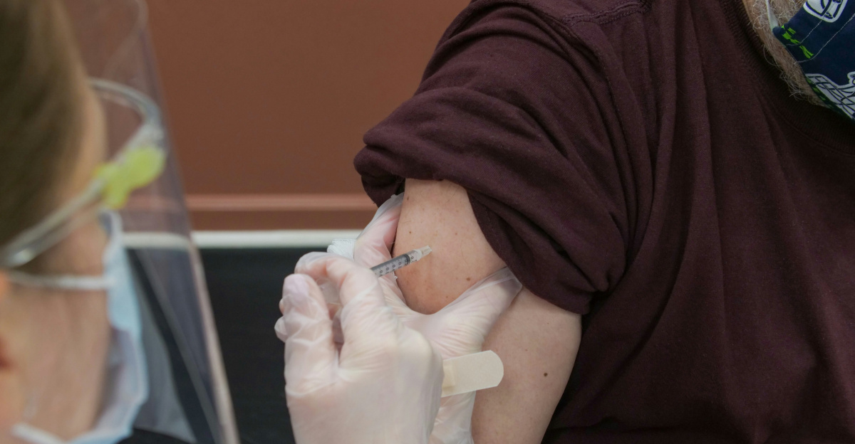 person in brown long sleeve shirt with white bandage on right hand