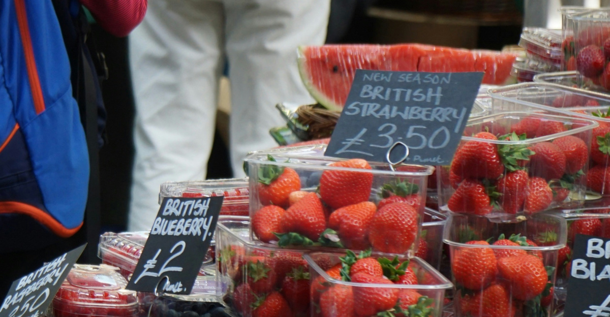 man in blue jacket standing beside woman in blue jacket