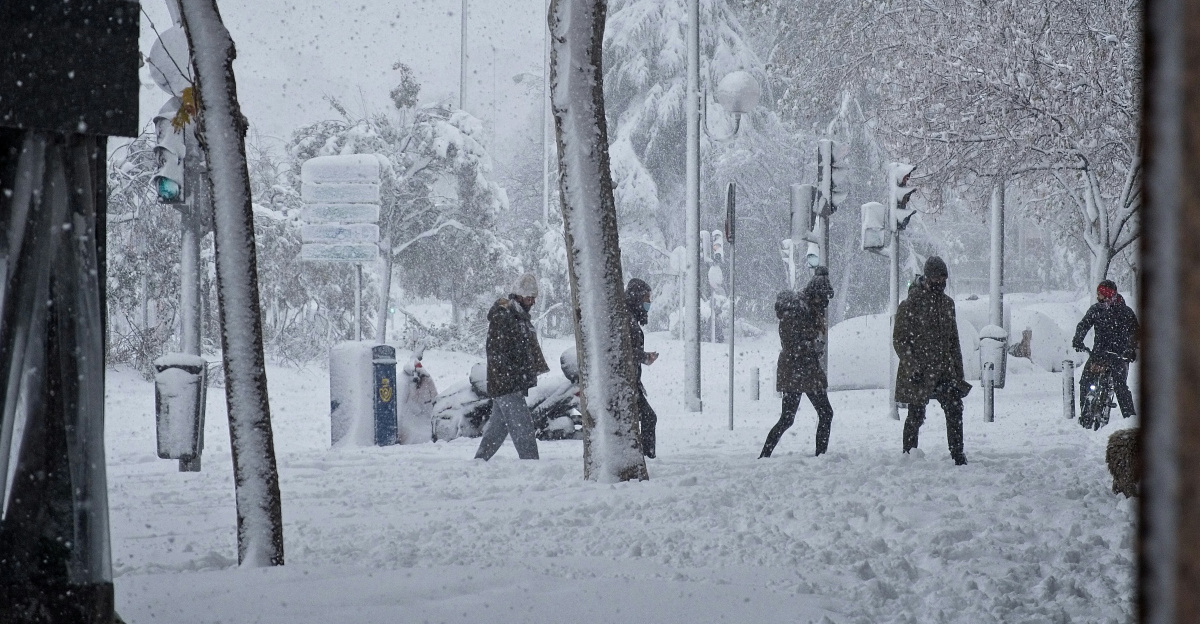 people walking on snow covered ground during daytime