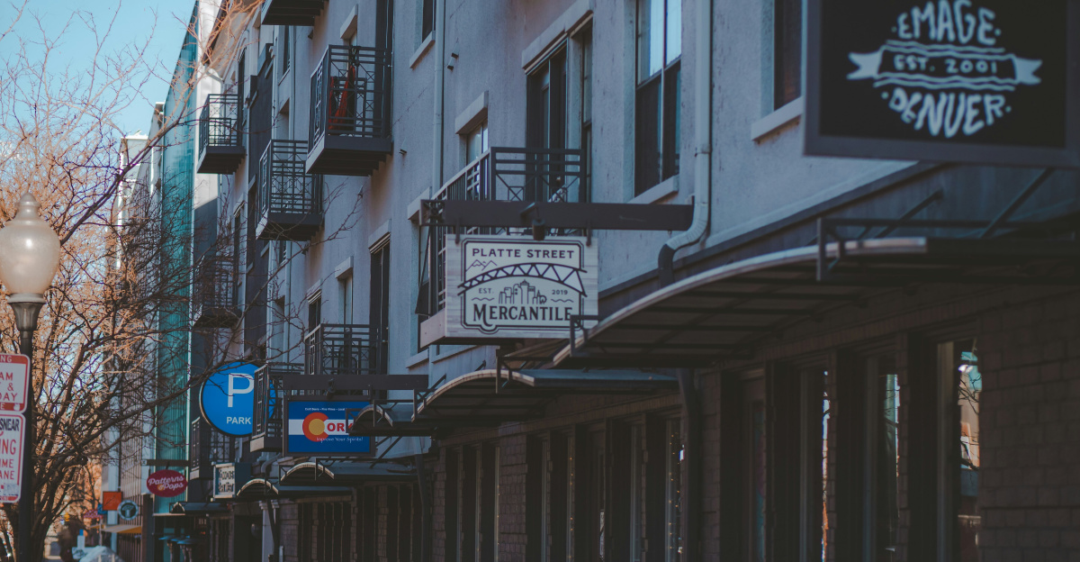 black steel gate near white concrete building during daytime