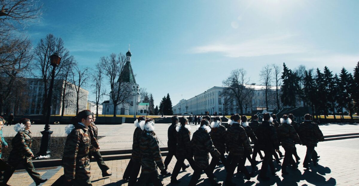 people walking on snow covered ground during daytime