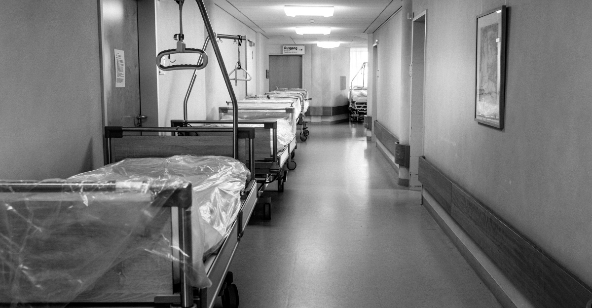 grayscale photo of hospital bed