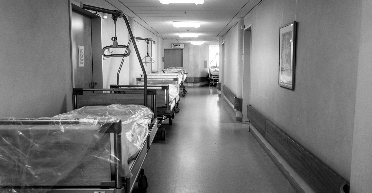 grayscale photo of hospital bed