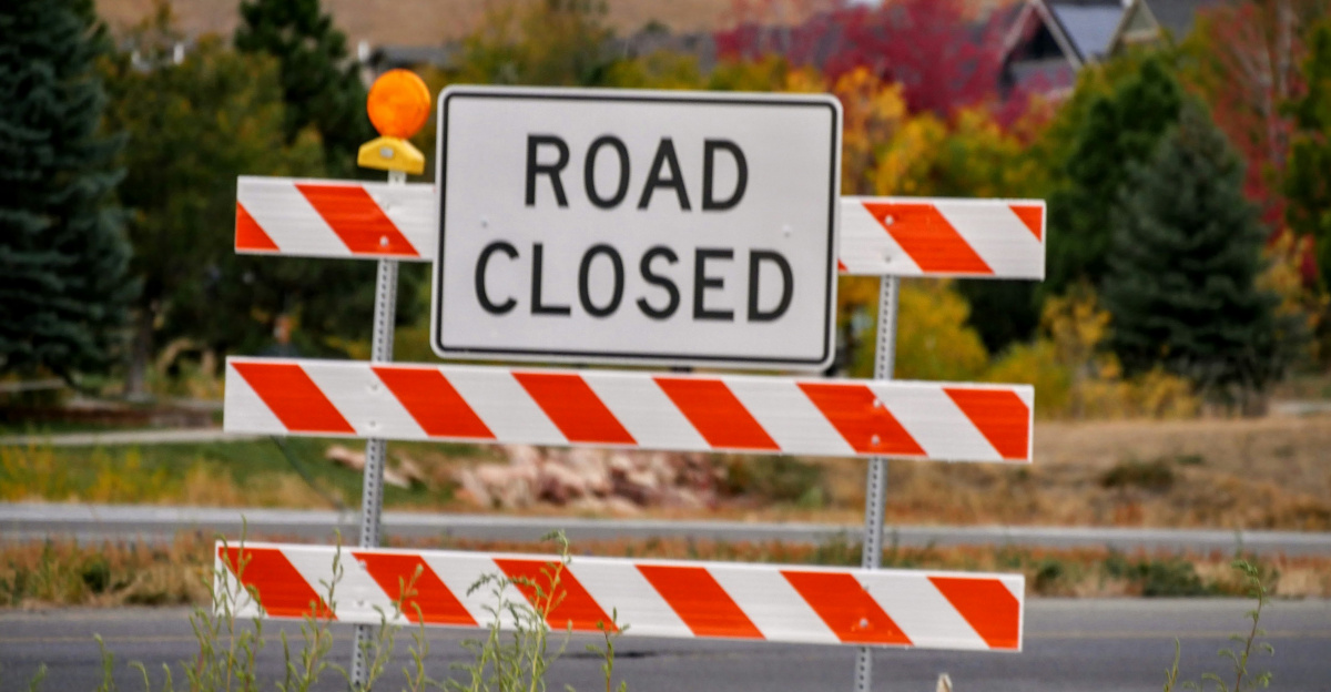 white and red wooden fence with no smoking sign