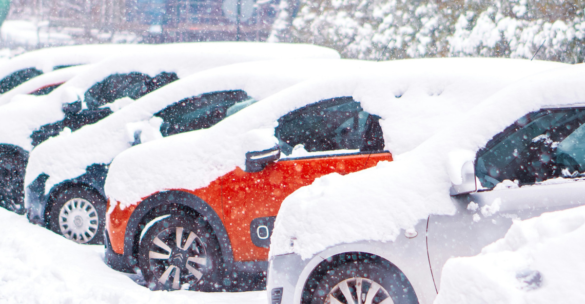 black suv covered with snow