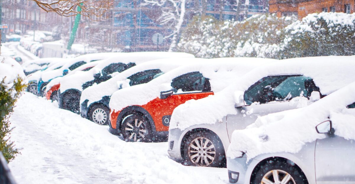 black suv covered with snow