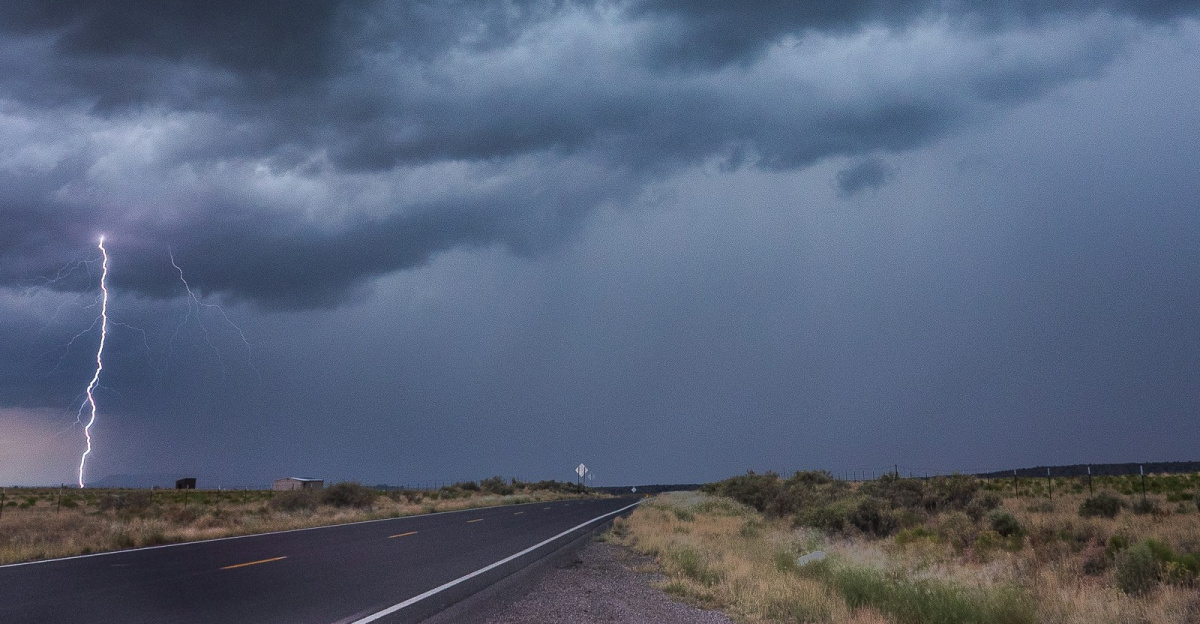 gray asphalt road under gray clouds