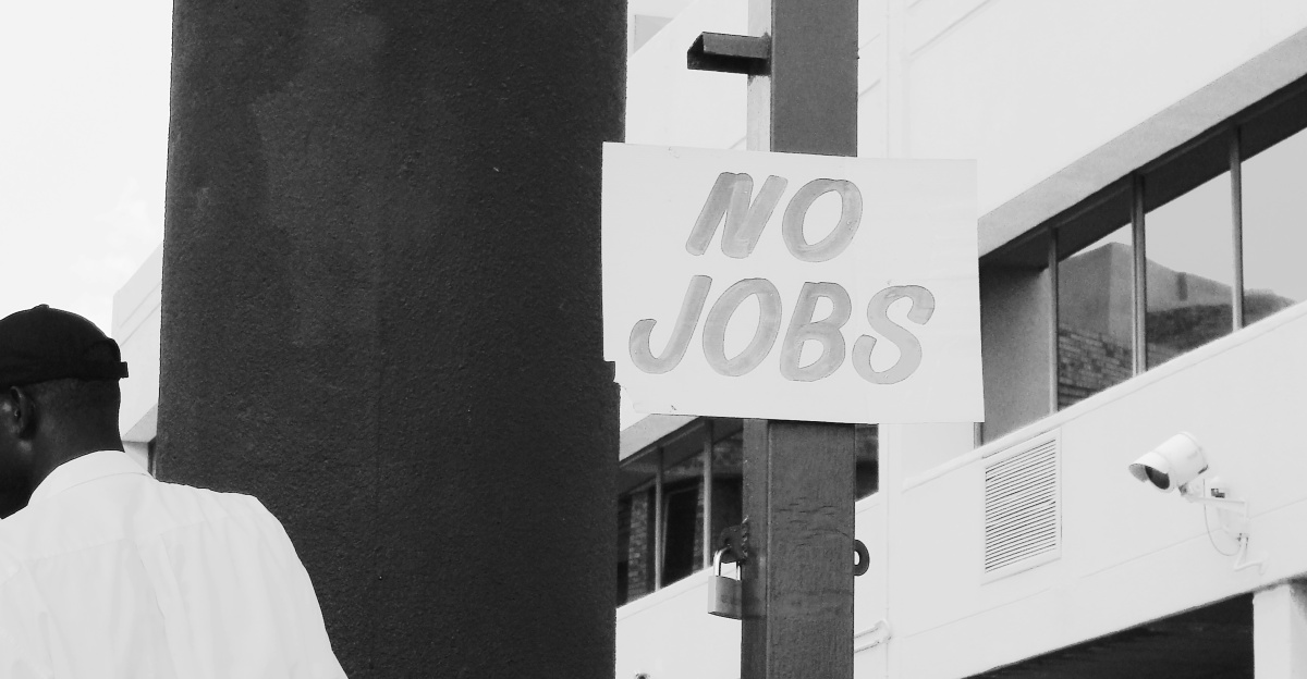man in white dress shirt standing near white and black camera