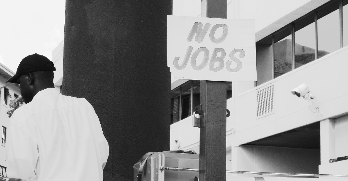 man in white dress shirt standing near white and black camera