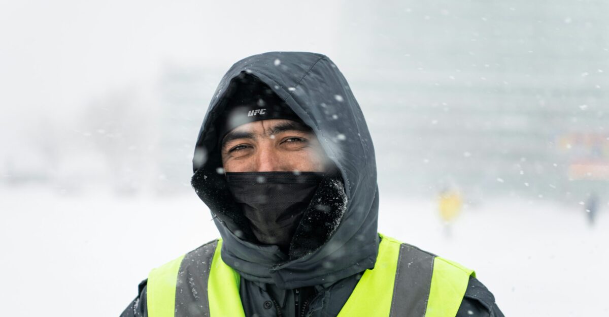 woman in black and green jacket